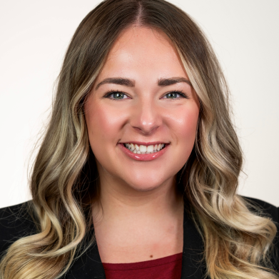 Headshot of Caitie Norrie, MA